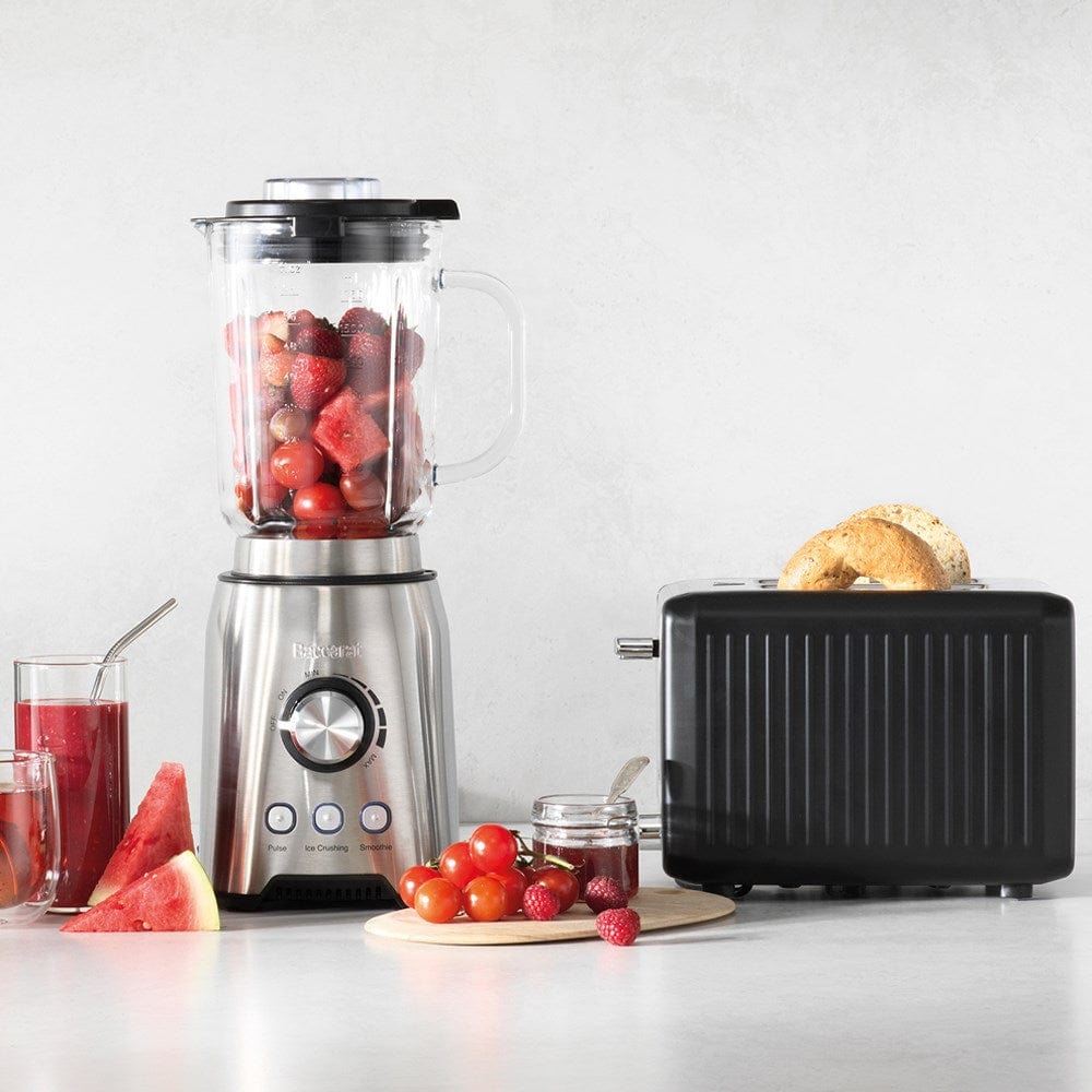 sleek black toaster surrounded by fresh bread and vibrant green avocados - Baccarat the toasty slice