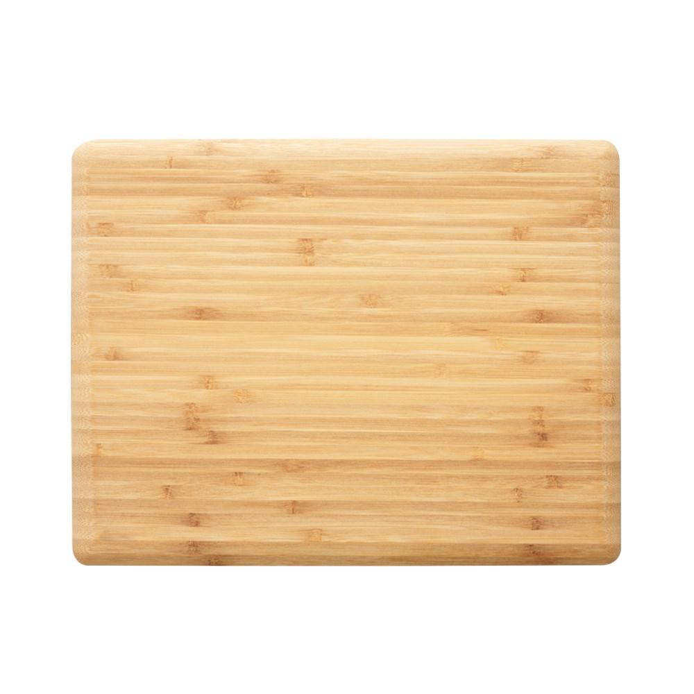 Bamboo chopping board in natural colour with clean white plates and utensils - Baccarat