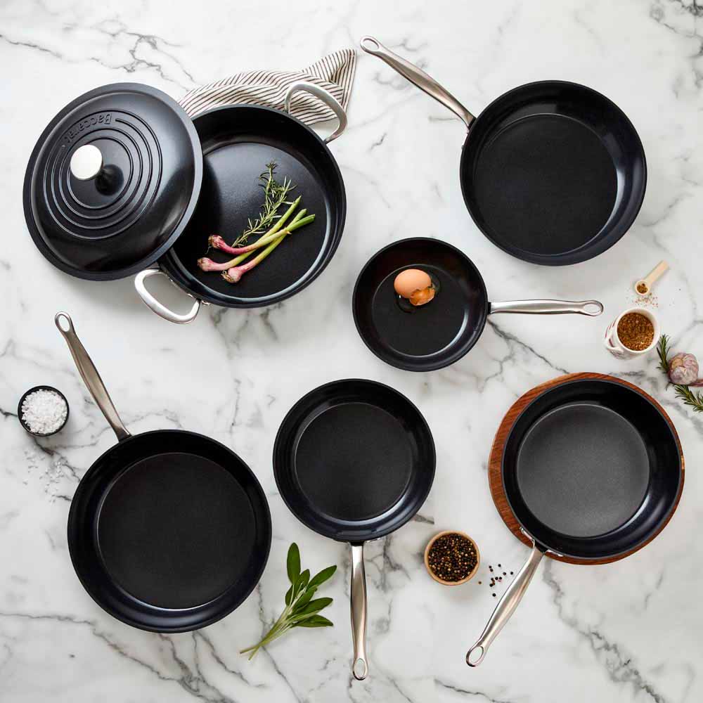 Close-up of a black cast iron skillet filled with vibrant ratatouille colour frypan 26cm - Baccarat