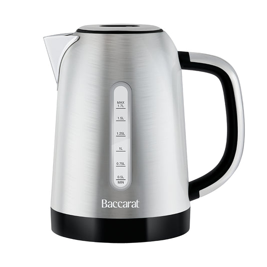 A Baccarat stainless steel electric kettle with a brushed silver finish, black handle and base, and white measurement markings on the front.
