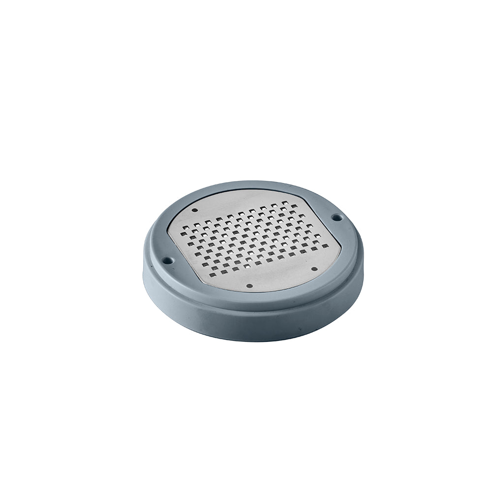 A dark grey circular fine-grater disc covered with tiny raised metal spikes is displayed.