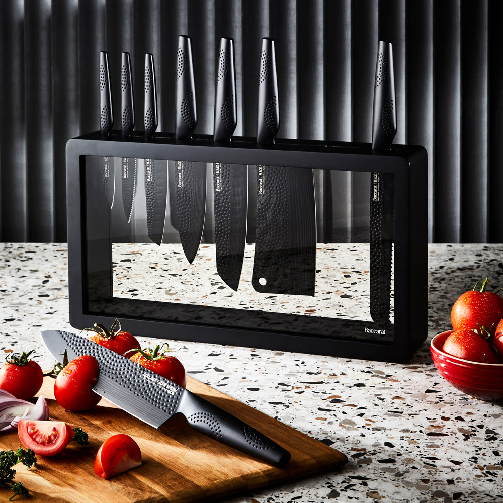 Sharp knives on speckled countertop with sliced tomatoes and onions - Baccarat id3 Black Samurai Syo