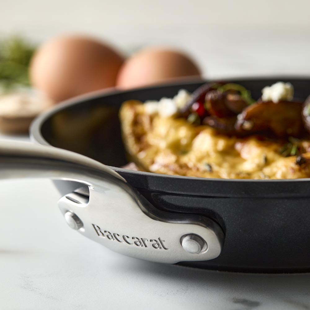 A sleek frying pan with a long handle black non-stick frying pan - Baccarat damashiro emperor makoto