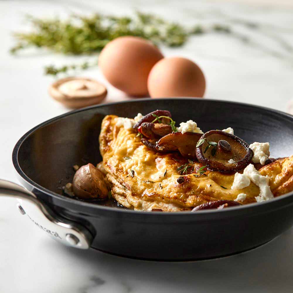 A sleek frying pan with a long handle black non-stick frying pan - Baccarat damashiro emperor makoto