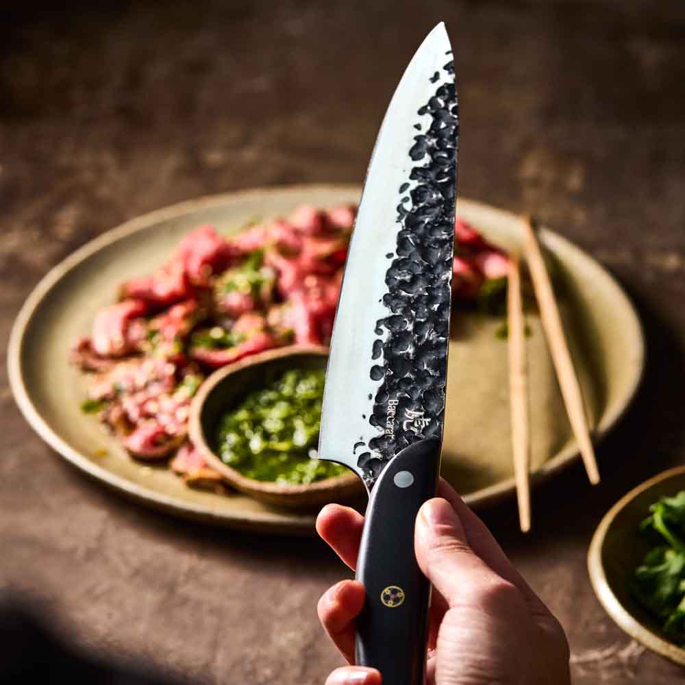 Man holding Baccarat KUROI KIBA Chefs Knife 20cm at Baccarat