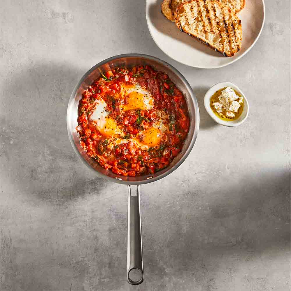 Baccarat Gourmet Stainless Steel Frypan 20cm with baked eggs on a grey kitchen counter at Baccarat