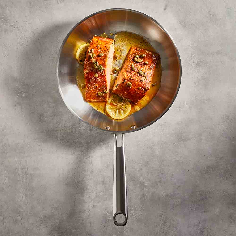 Baccarat Gourmet Stainless Steel Frypan 26cm with lemon and caper salmon fillets at Baccarat