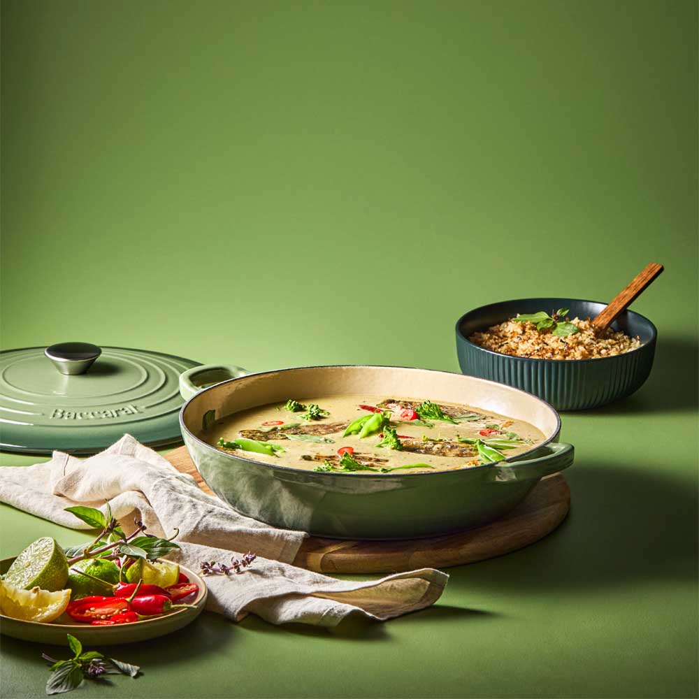 curry in green saute pan with a side of rice - Baccarat