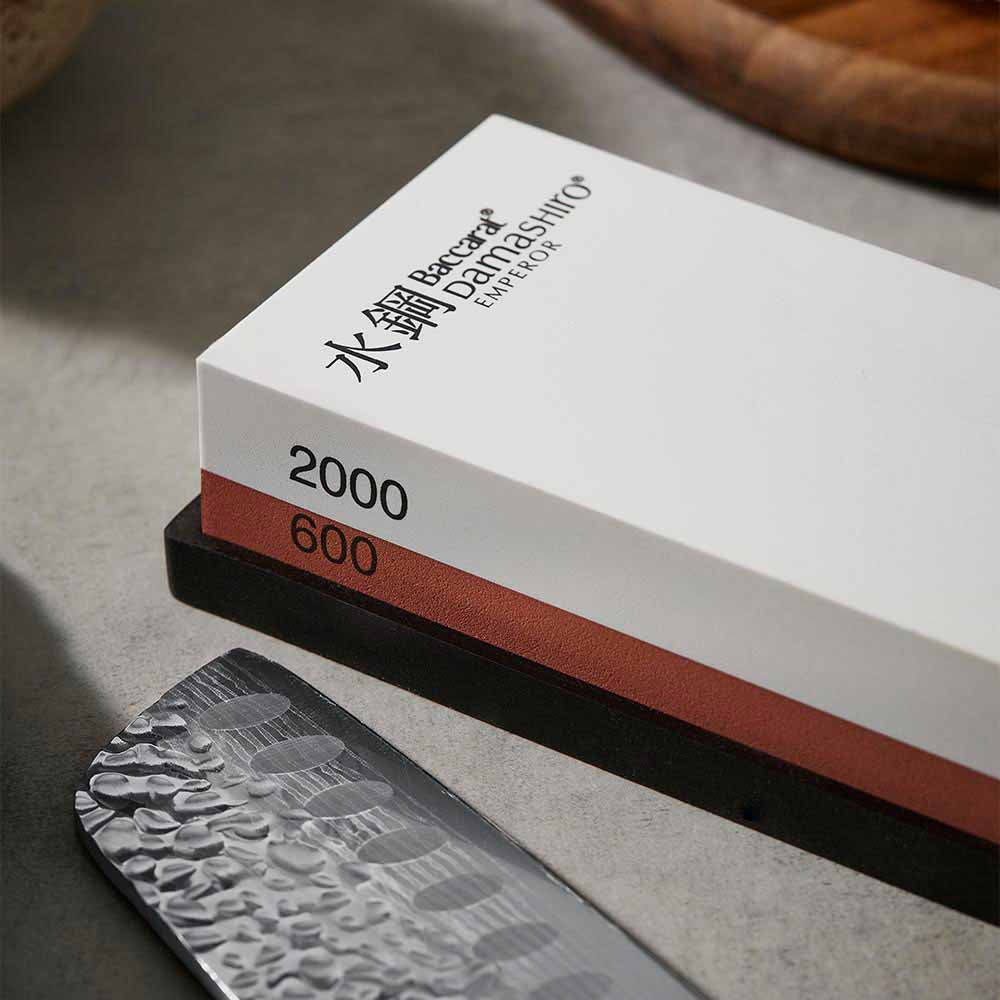Close up of 600/2000 whetstone and santoku knife - Baccarat