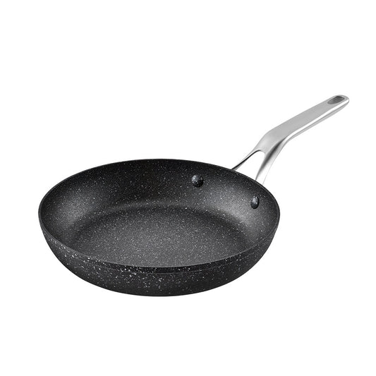 Black speckled frying pan with a silver handle on a white background