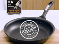 A black frying pan with vegetables and a fried egg hard anodised cookware 22cm fry pan - Baccarat